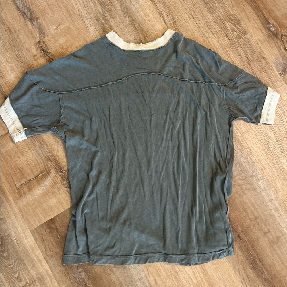 Size Small green tee with tan stripe on arm New without tags Never worn